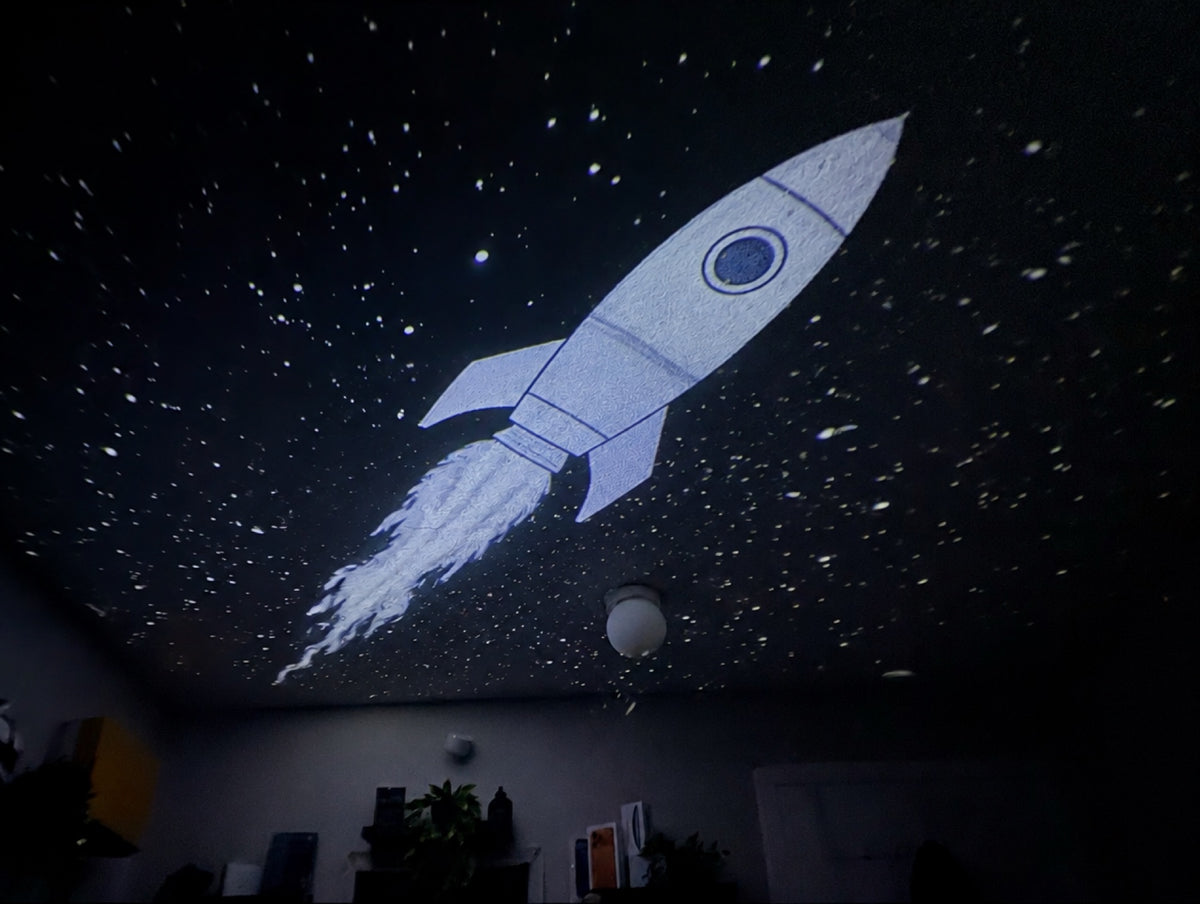 Rocket projected on a bedroom ceiling