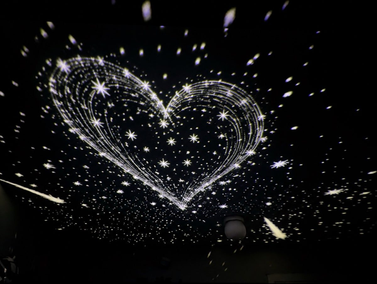 Heart of stars projected on a ceiling
