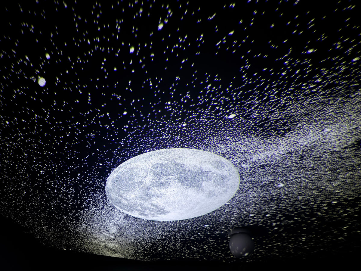 Real photo: moon and Milky Way projected on a ceiling with Lunova Sky